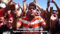 Venezuela delays removing currency bills amid protests