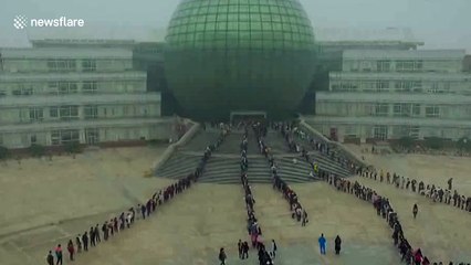 Thousands of students line up outside university library to study