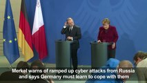Merkel warns of ramped up Russia cyber attacks ahead of vote-vnFwqubHFQs