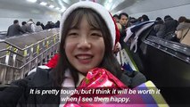 Young volunteers visit the needy dressed as Santa in Seoul