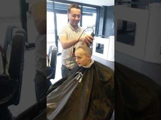 Woman headshave at a salon