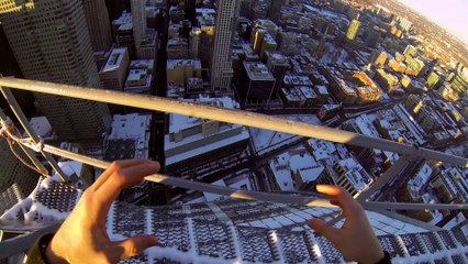 Daredevil Climbs Icy Crane