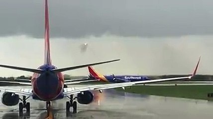Cool video of a Southwest plane flying through a wall of rain before landing.