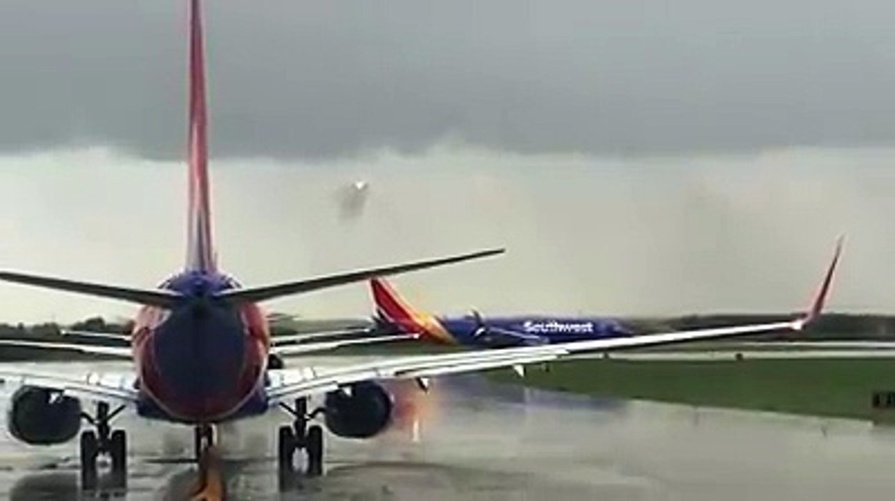 Cool video of a Southwest plane flying through a wall of rain before landing.