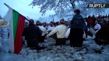 Hardy Bulgarians Perform Traditional Dance in Icy River for Epiphany