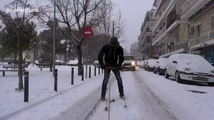 Man skis though city streets in Thessaloniki, Greece