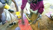 Business idea. Experts from Africa produce stoves made of iron barrels