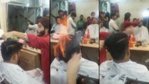 Cet indien met le feu volontairement aux cheveux de son client