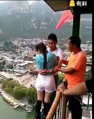 lover dive Chinese Couples Diving from a Tall Building
