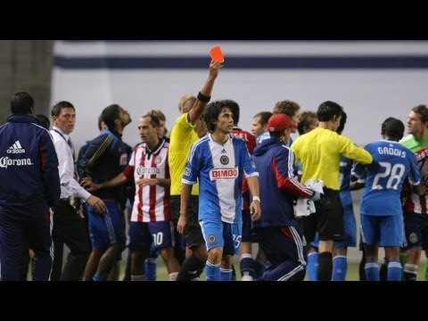 RED CARD: Gabriel Farfan tackle clears the benches - Coach Peter Nowak ejected