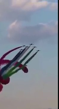 Airplanes making UAE flag in air with the colorful smokes.