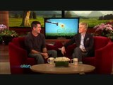 Ellen DeGeneres makes Simon Cowell laugh. (Rabbit head)