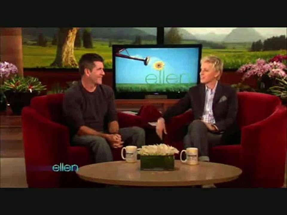Ellen DeGeneres makes Simon Cowell laugh. (Rabbit head)