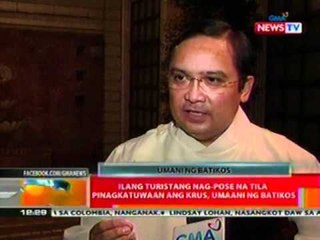 BT: Ilang turistang nag-pose na tila   pinagkatuwaan ang krus, umaani   ng batikos