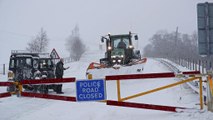 Europe grapples with plunging temperatures, flood threats and heavy snowfall