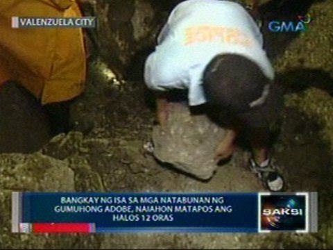 Saksi: Bangkay ng isa sa mga natabunan ng gumuhong adobe, naiahon matapos ang halos 12 oras