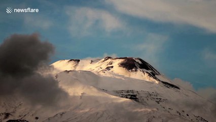 Snow and lenticular clouds over Mount Etna