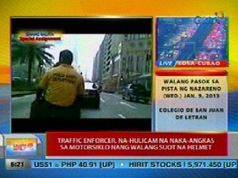 UB: Traffic enforcer sa Makati, na-hulicam na naka-angkas sa motorsiklo nang walang suot na helmet
