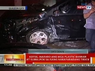 BT: Kotse, inararo ang mga plastic barrier at sumalpok sa isang nakaparang truck sa QC