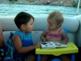 Ethan & Eva talking on the boat float