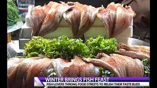 Enjoying Fish Feast In Winter and Cold Weather