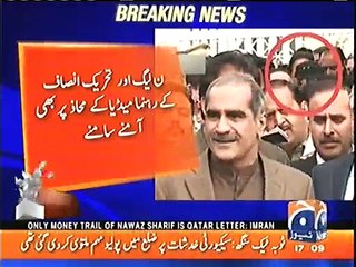 Imran khan smiling right behind Khawaja Saad Rafique in SC during media talk