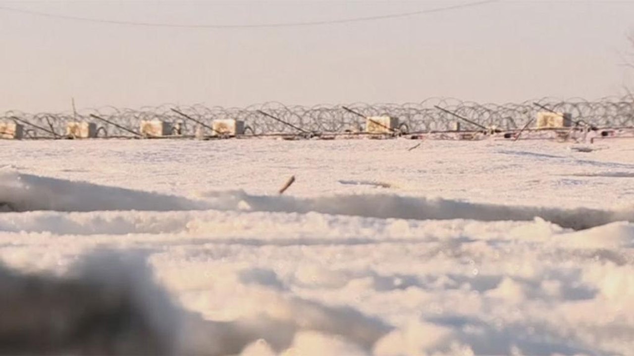 Refugees wait at the border