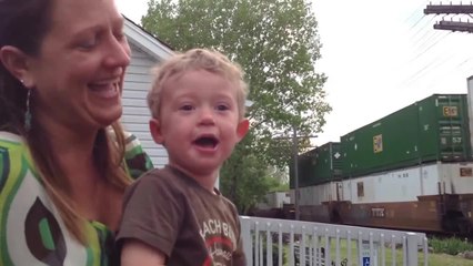 Engineer's toddler son realizes his dad is driving passing train