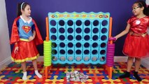 Superhero Kids! Supergirl vs Iron Girl Giant Connect 4 Toy Challenge - Shopkins Num Noms Gross Toys