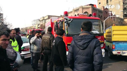 Many Iran firefighters feared trapped in building collapse
