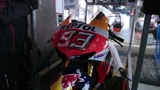 Marc Marquez rides a Honda RC213V on a downhill ski course