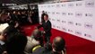Tom Hanks jokes with photographers on the red carpet of The 2017 Peoples' Choice Awards