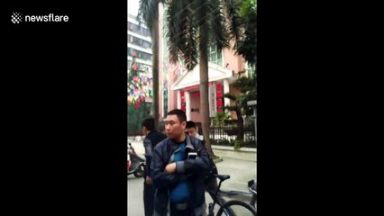 Cash carrier drops money by mistake, people step in to protect it