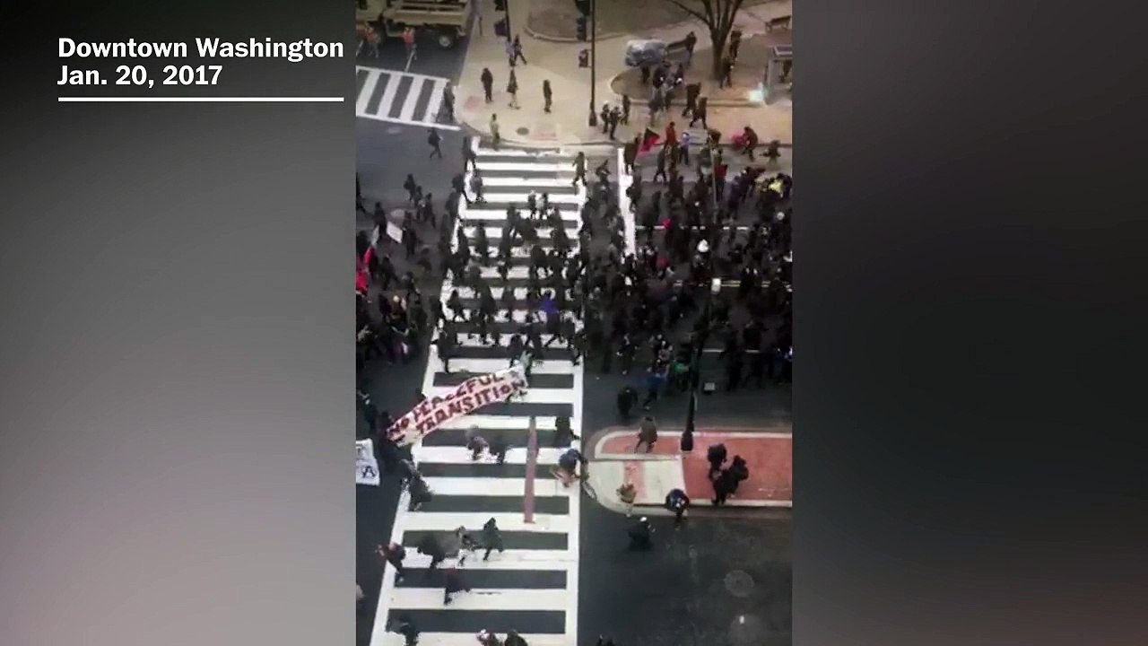 Anti-Trump protesters march in downtown Washington