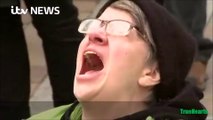 An anti-Trump protester screams 'no' as Donald Trump is sworn in as the 45th US President