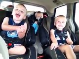 Identical twins playing on a road trip-83yCdmeY3wE