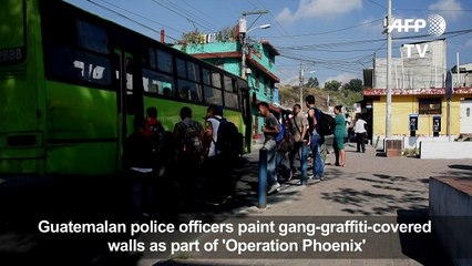 Gang graffiti erased by police officers near Guatemala City