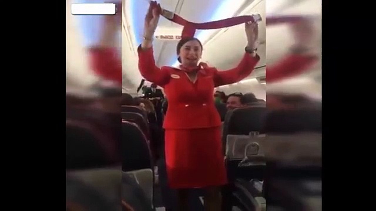 Football fans distracting the Air Hostess on flight during  the safety announcement-ea4hDyprVvY
