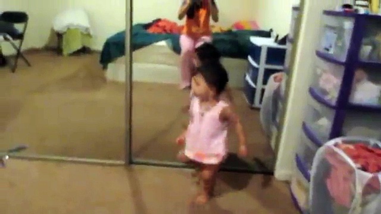 Kid on her reflection