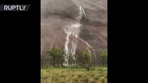 Record-breaking desert rains send waterfalls down Australia’s Ayers Rock-pes9ADA3LyM