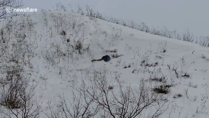Sliding down a very snowy slope