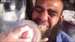 LiveLeak - Man gets his yellow teeth whitened with a car polisher