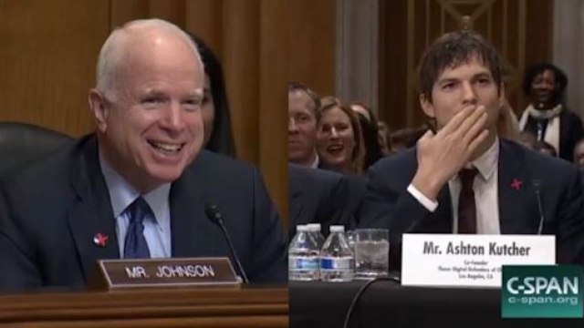 Ashton Kutcher blows a kiss to Senator John McCain