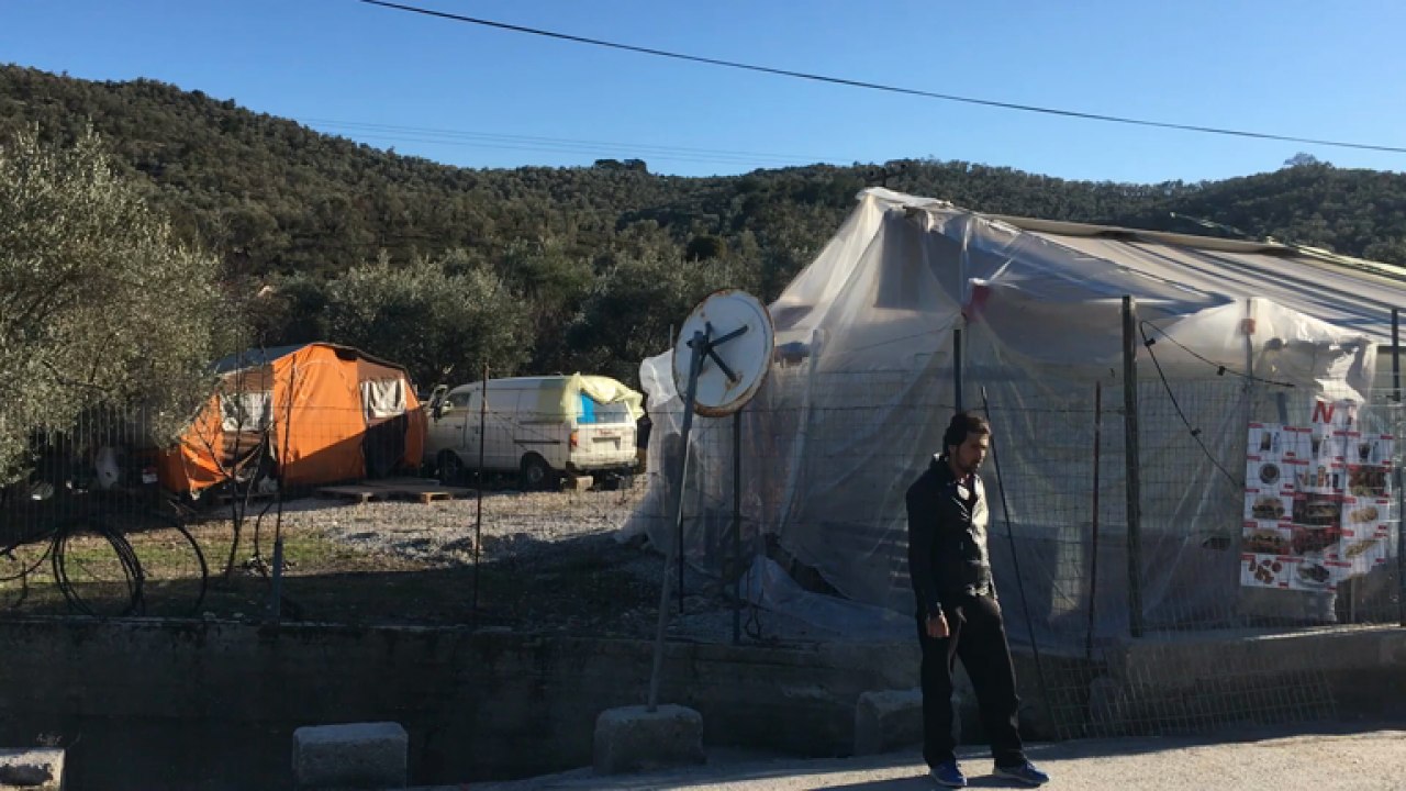 Refugees outside the Moria camp on the Greek island of Lesbos
