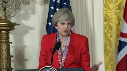 Theresa May: President Trump is "100%" behind NATO