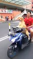 dog drive motocyle and man sitting back seat