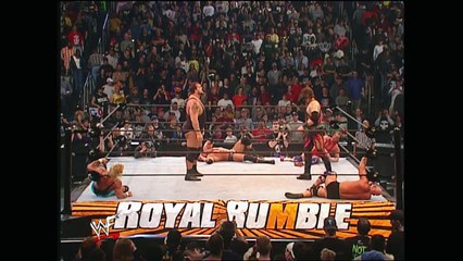 Kane shows off his immense strength by lifting Big Show over the top rope