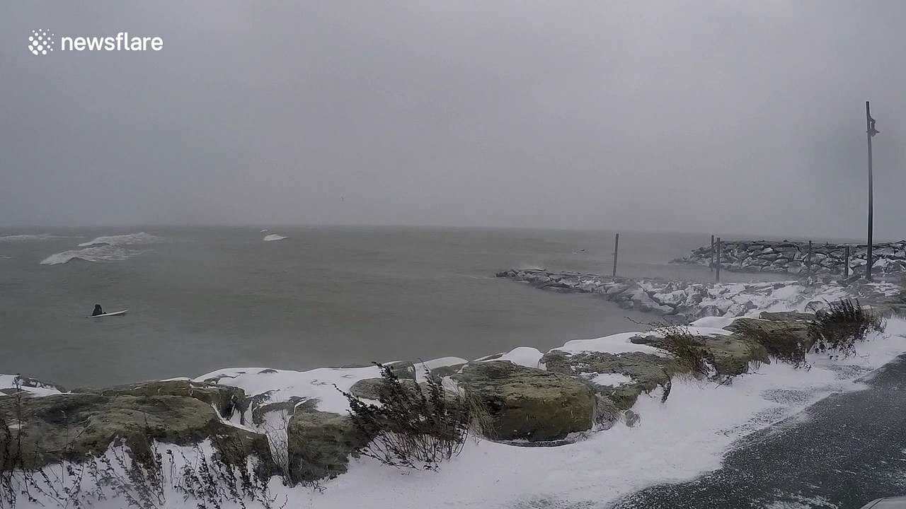 Surfer braves freezing temperatures on Lake Eerie