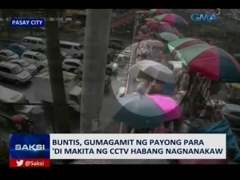 Saksi: Buntis, gumagamit ng payong para 'di makita ng CCTV habang nagnanakaw