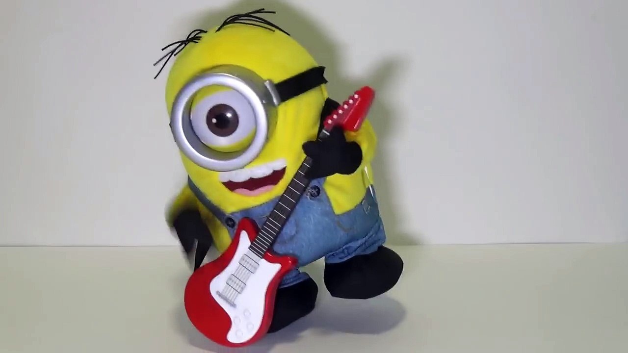 Minions Stuart Rock N Roll singing, playing his guitar and dancing